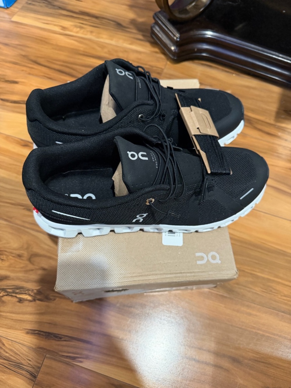 On Running Black Athletic Shoes with White Soles